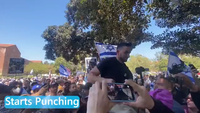 🚨A zionist counter-protester DIVE BOMBED onto a crowd of pro-Palestinian USC student protesters—and started throwing punches. Footage shot by Notorious Tinatanium 🆓. So far, mainstream media has ignored this college campus violence...perpetrated by a pro-Israel counter protester.