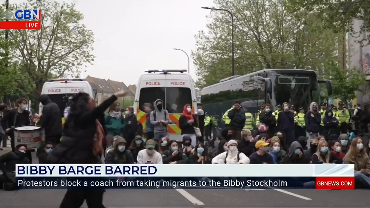 'Let's be frank, the police aren't doing anything by the looks of it!' Emily Carver Protesters blocked and danced in the road to prevent a coach from moving migrants from a hotel to the Bibby Stockholm. Activists slashed the tyres and wedged a bicycle under its wheel.