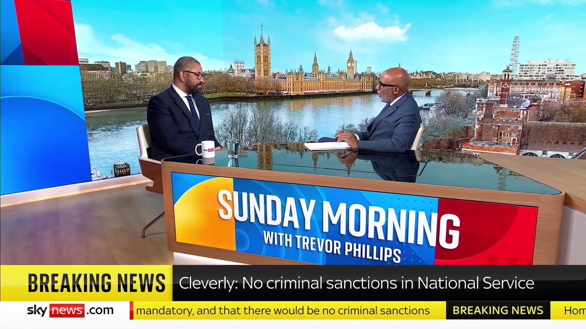 "No one's going to jail over this." Home Secretary James Cleverly🇬🇧 says the Tories' mandatory National Service plans are "about building a network across society" and also confirms volunteering won't be paid. #TrevorPhillips 📺 Sky 501 / YouTube