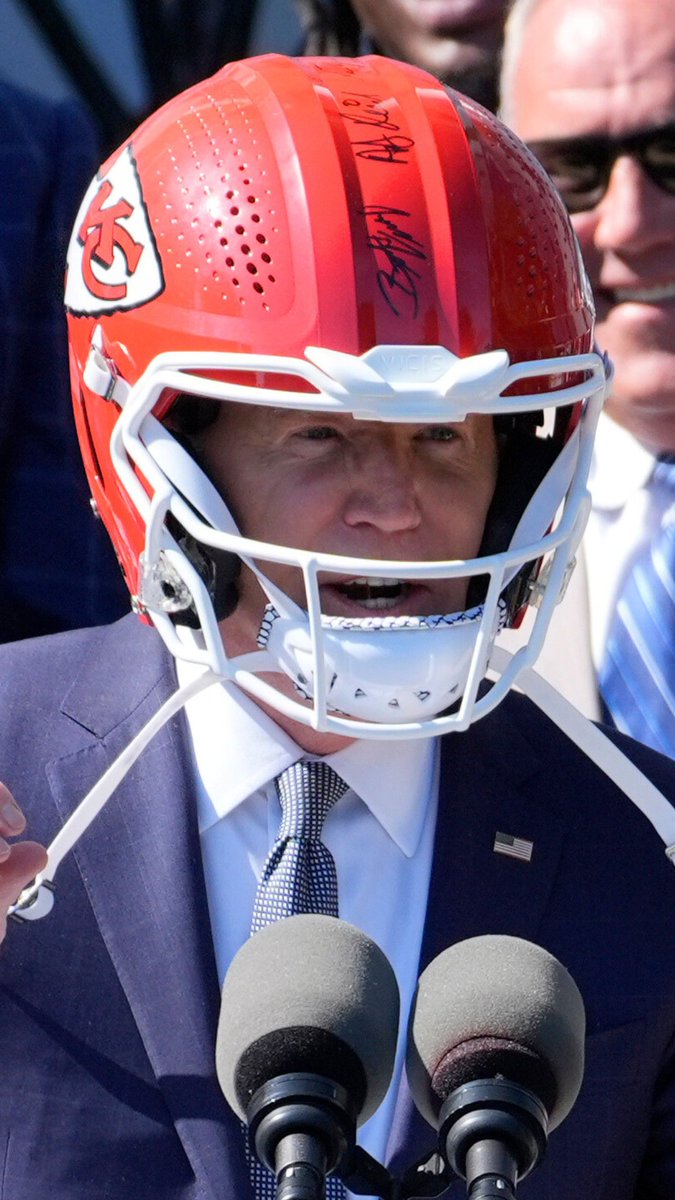 While hosting the Kansas City Chiefs at the White House to celebrate their 2024 Super Bowl championship, U.S. President Biden wears the team's football helmet.