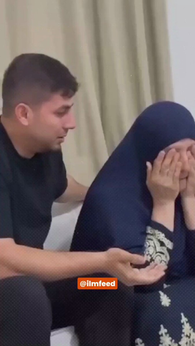 A Palestinian mother whose son was martyred by the occupation forces praises Allah.