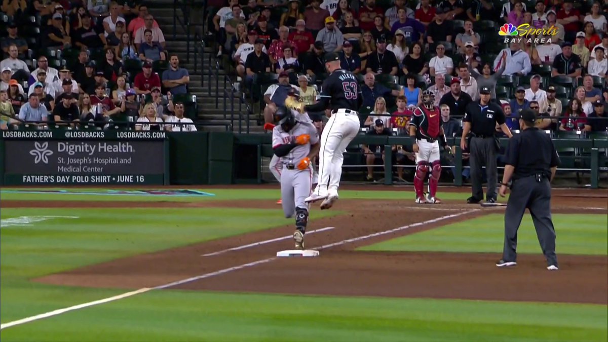 The go-ahead run was taken off the board after Arizona's challenge overturned this call