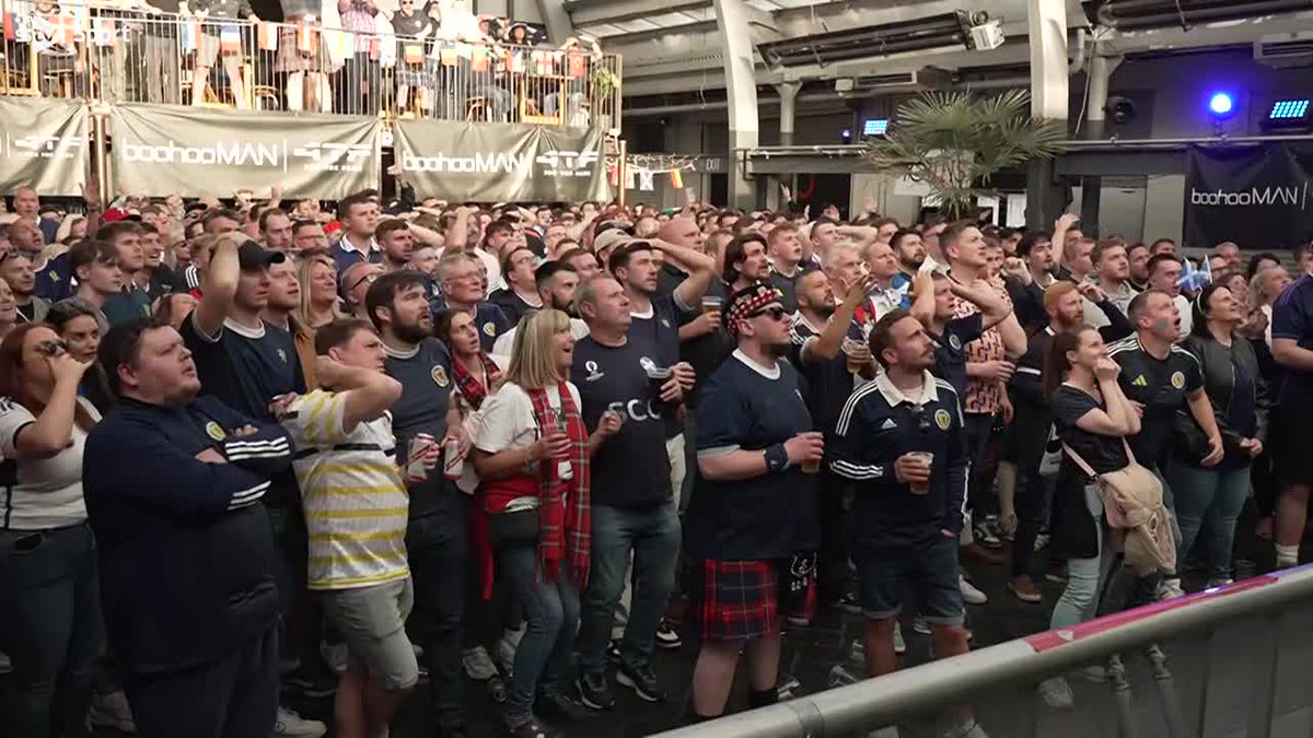 Scotland fans at the Barras in Glasgow celebrate the opening goal against Switzerland. Live updates: