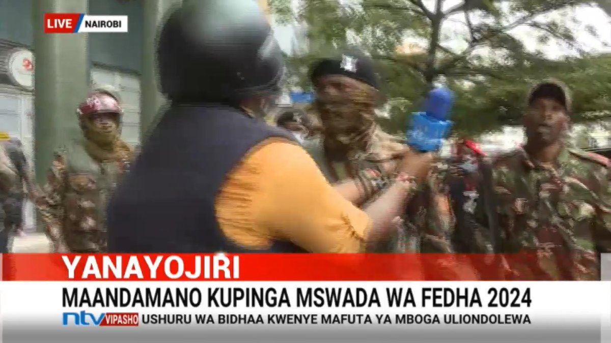 NTV's Ibrahim Karanja. confronts anti-riot policeman for beating up protester Livestream: