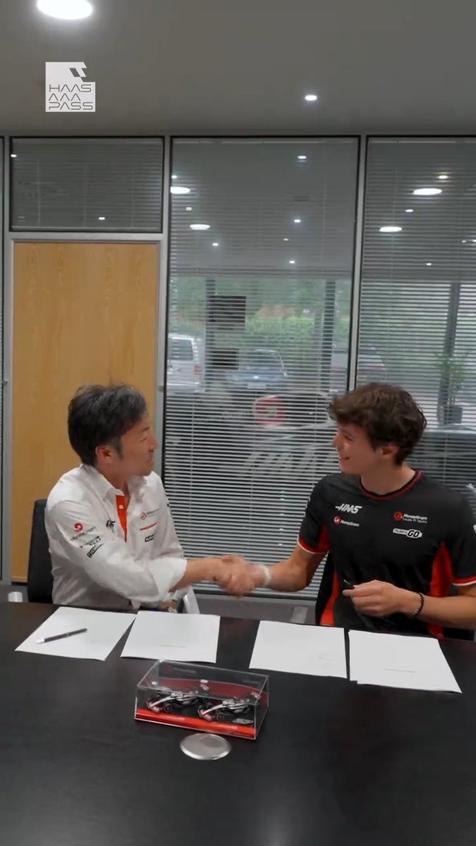 Contracts and Content ✍️📸 Capturing the day Ollie went from F2 to F1 🙌📹 Head to the link in our bio to watch in full on YouTube 👇 #HaasF1 | Ollie Bearman