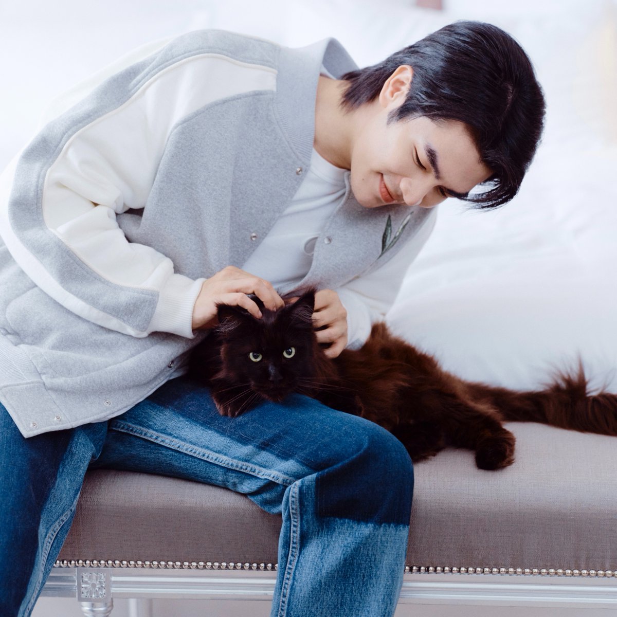 Kitten encounter. Dior ambassador @MilePhakphum is getting ready to head off to the #DiorSummer25 show in Paris, wearing a look from Kim Jones's new collection, temporarily trading his feline friends for artist Hylton Nel's huge runway versions. Tap the card to watch the video.
