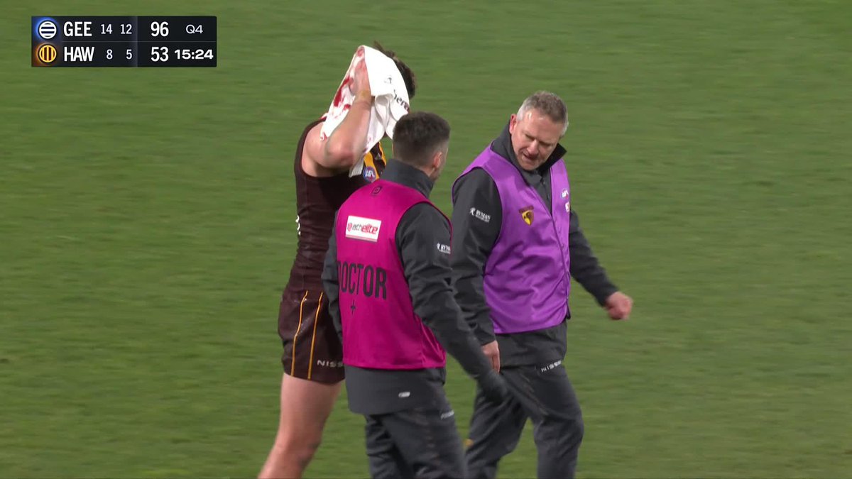 Mitch Lewis has come from the ground following this contest. #AFLCatsHawks