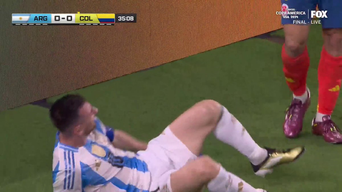 Messi rolls around in pain after some heavy contact