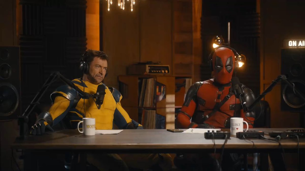 Deadpool and Wolverine record a podcast together.
