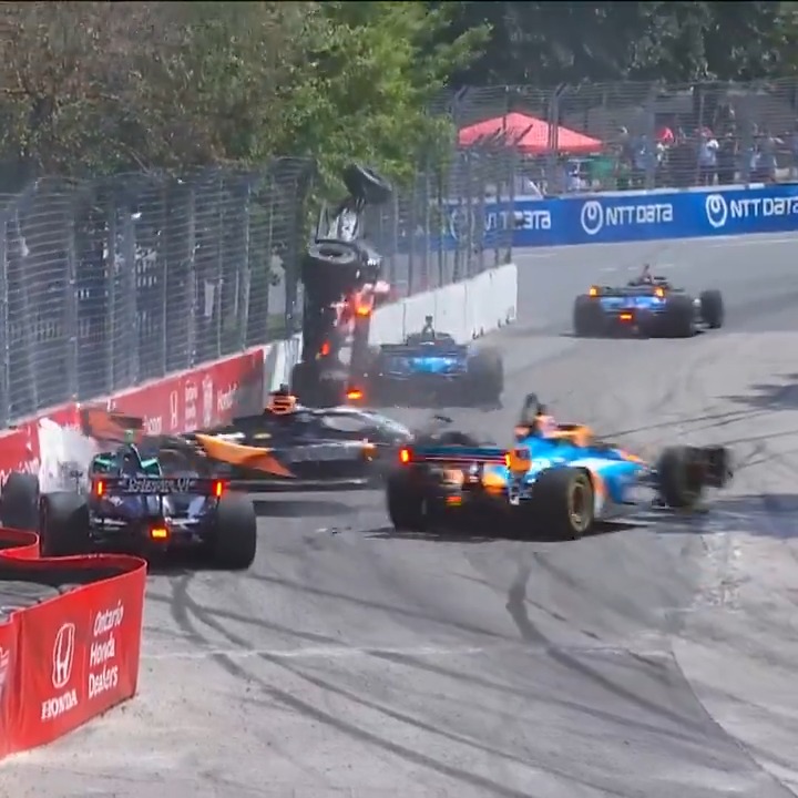 A massive Turn 1 incident involving multiple cars sends the No. 14 airborne. The red flag has been displayed. 📺: #IndyTO on Peacock
