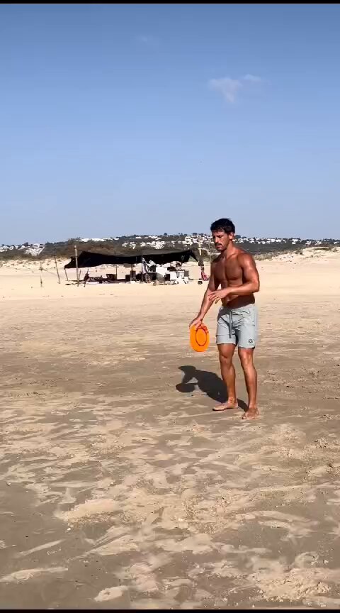 man dancing with frisbee