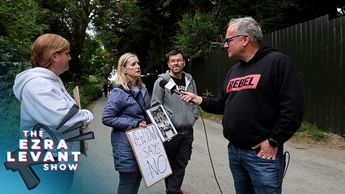 Migrants refuse to answer questions as locals protest outside housing facility 'Word has gone out that they're getting everything given to them here,' one Newtownmountkennedy local told Ezra Levant 🍁🚛. On Monday night's episode of The Ezra Levant Show, Ezra's continued his exclusive reporting from Ireland, where residents have been pushing back against migrant housing facilities being set up in the country. Earlier this year, a riot erupted in the small town of Newtownmountkennedy as resistance to a proposal to house asylum seekers boiled over. Protests have continued, where Levant heard from demonstrators who gathered outside of the facility. The protesters explained how in many circumstances, asylum seekers will first travel through France, then through the United Kingdom before eventually arriving in Ireland. Once there, European Union laws complicate the process for removal — if government officials even cared to bother deporting migrants. Outside of the housing facility, a large metal wall blocks the view from outside. Masked individuals inside then threw a rock at our Rebel News camera while trying to capture footage through a gap under the gate. “Word has gone out that they're getting everything given to them here,” one of the protesters told Levant. She continued: Housing and food, benefits, everything. And they're getting more here than in the U.K., so naturally they're saying to themselves and their buddies, 'Let's go to Ireland, we'll have a good life there, we'll be given everything and not have to work.' And presto, here they are and they're with their London and Manchester accents pretending they're Palestinian and they're fleeing war. At another point, a group of men were walking back to the facility. Levant caught up with the men, asking them about the facility and how they arrived in Ireland, only to be met with silence as the men then returned behind the large metal wall. “I like the idea of a man with a gate and a fence,” Levant remarked. “I think the Irish should take inspiration from this guy with a gate and a fence. I think an Irish government should have a fence just like this, and hire a security guard just like that, and if anyone wants to come in the country, they should slam the door in their face just like that.”