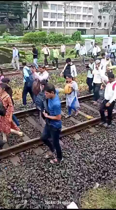 Mumbaikars walking on railway tracks to reach their office due to failure of local train service. Just ask a simple question: Can you even imagine torture of citizens like this in any civilised country?