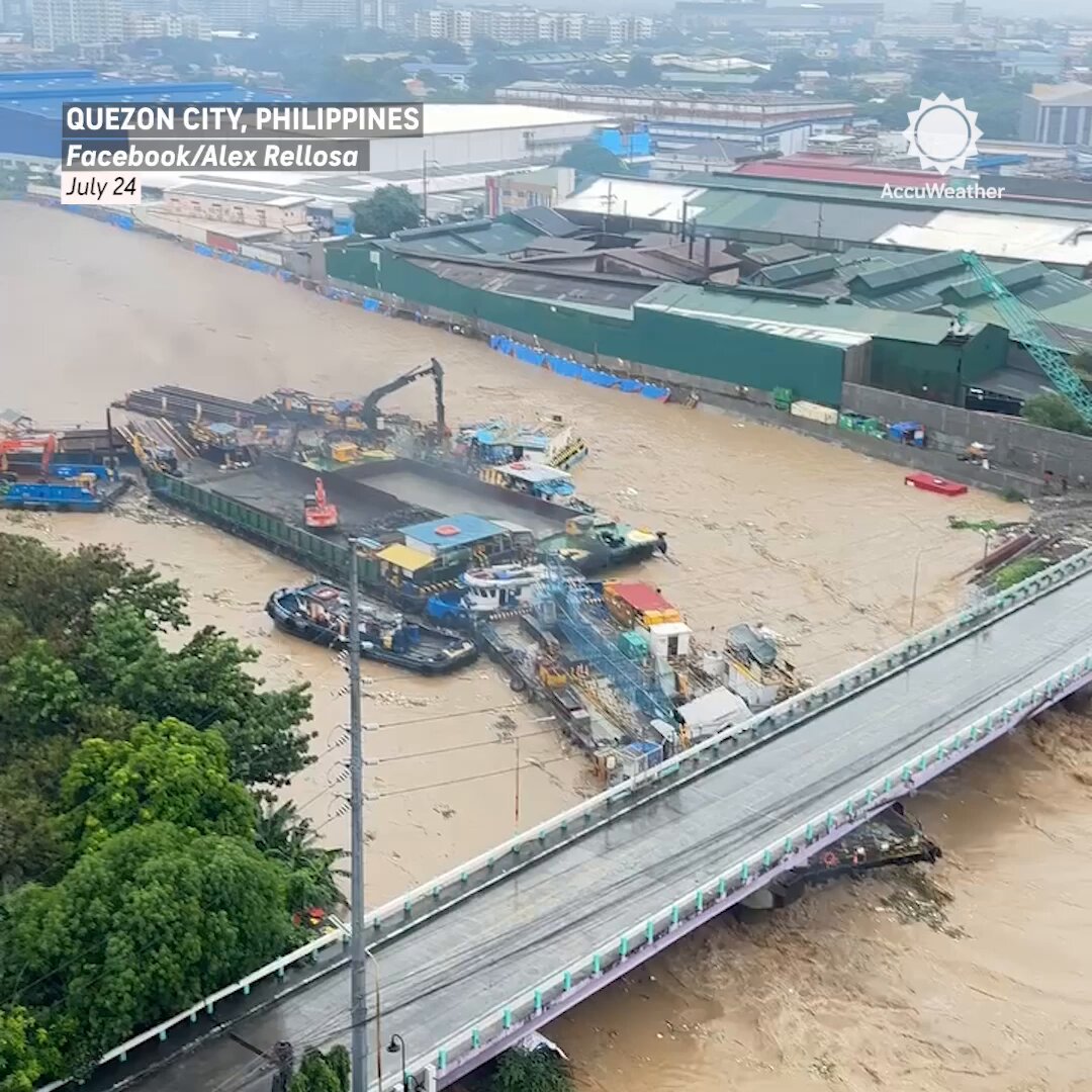Multiple barges and boats slammed into each other, and a bridge along a typhoon-swollen river in the Philippines on Wednesday.