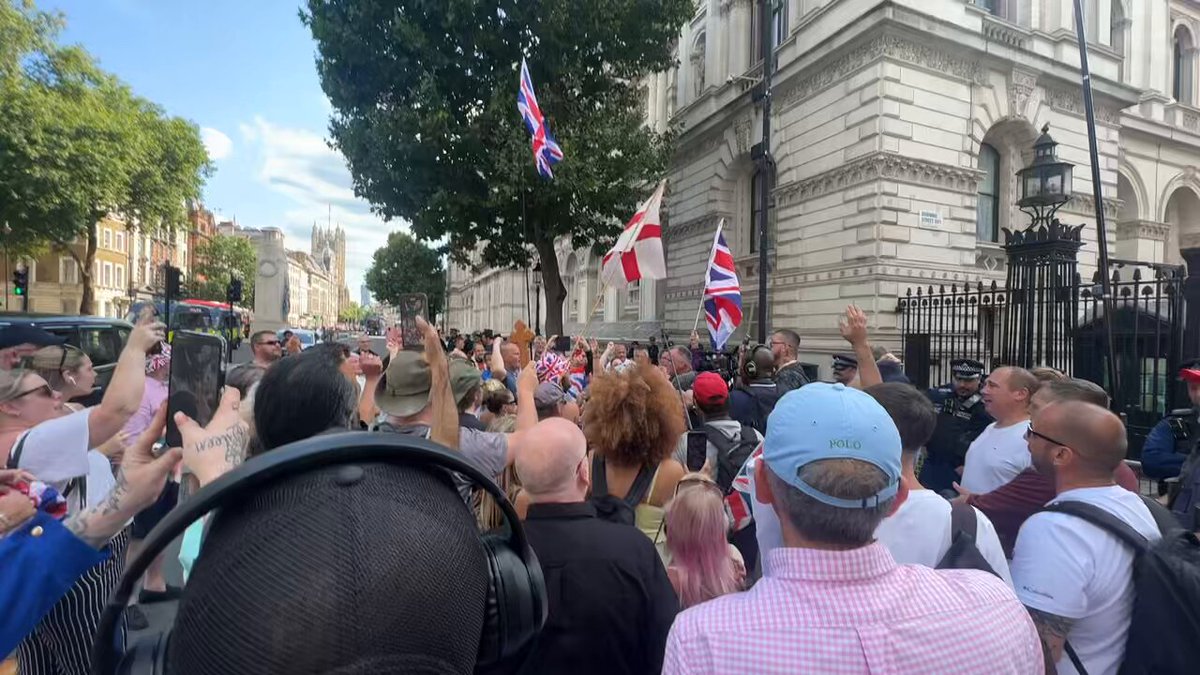 BREAKING: Crowd of people have gathered outside the government building in London to protest the arrest of Tommy Robinson.