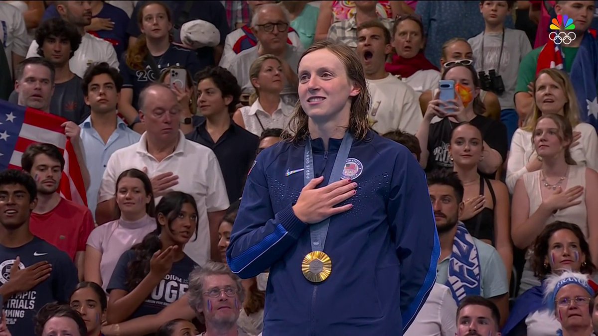 QUEEN KATIE 👑🇺🇸 The U.S. national anthem is played for 12-time Olympic medalist Katie Ledecky for the first time at the #ParisOlympics.