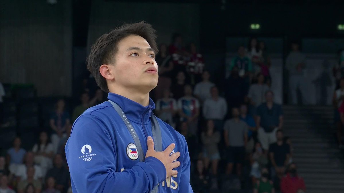 ALAB NG PUSO 🇵🇭🥇 Carlos Yulo proudly sings the Philippine National Anthem for the second time at the Olympic Games Paris 2024 after winning another Olympic gold medal, this time in the men's vault finals! #OlympicGames #Paris2024 #100TaongLaban #ParaSaBayan