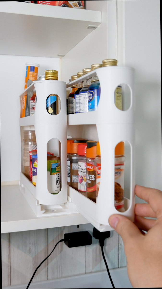 The Spice Rack Pullout by SpongyBob is a compact solution for organizing spices in tight spaces. 🌶️ 🧂 It pulls out and rotates 90 degrees for easy access. 🛠️ With two shelves, it neatly stores both small and larger spice jars. 💡