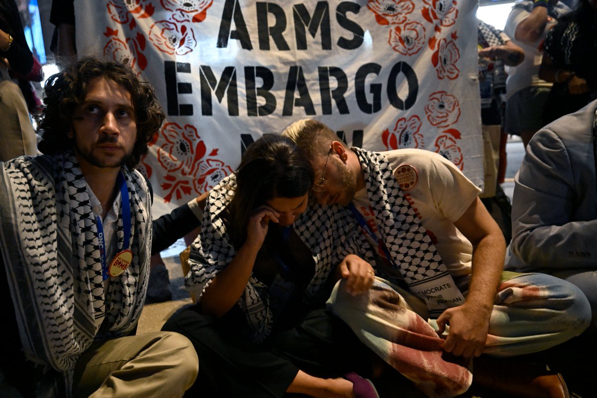 WATCH: Delegates from the Uncommitted Movement and their allies launched a sit-in protest Wednesday outside the DNC after the party refused to honor the request for a Palestinian speaker take the main stage and speak about Gaza.