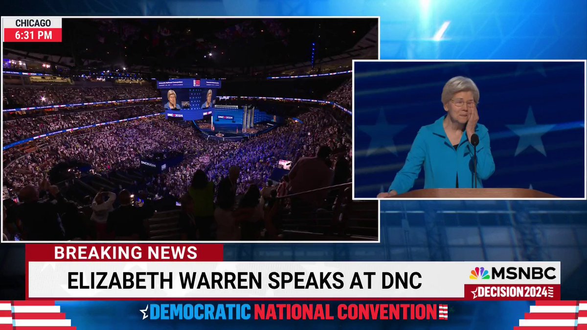 Sen. Elizabeth Warren, D-Mass., wipes away tears as the crowd erupts in cheers for her as she takes the stage for her DNC speech.