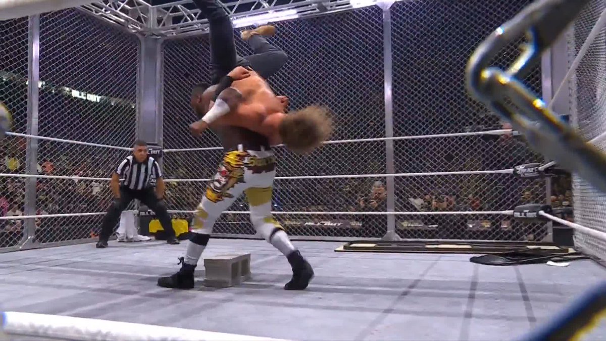 Swerve hits a vertebreaker on a cinder block to Hangman. #AEWAllOut