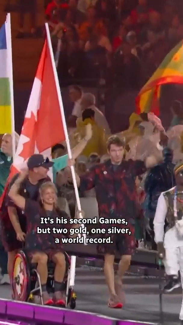 Waving the FLAG 🇨🇦 Canoeist Brianna Hennessy and swimmer Nicholas Bennet lead the way for Team Canada!