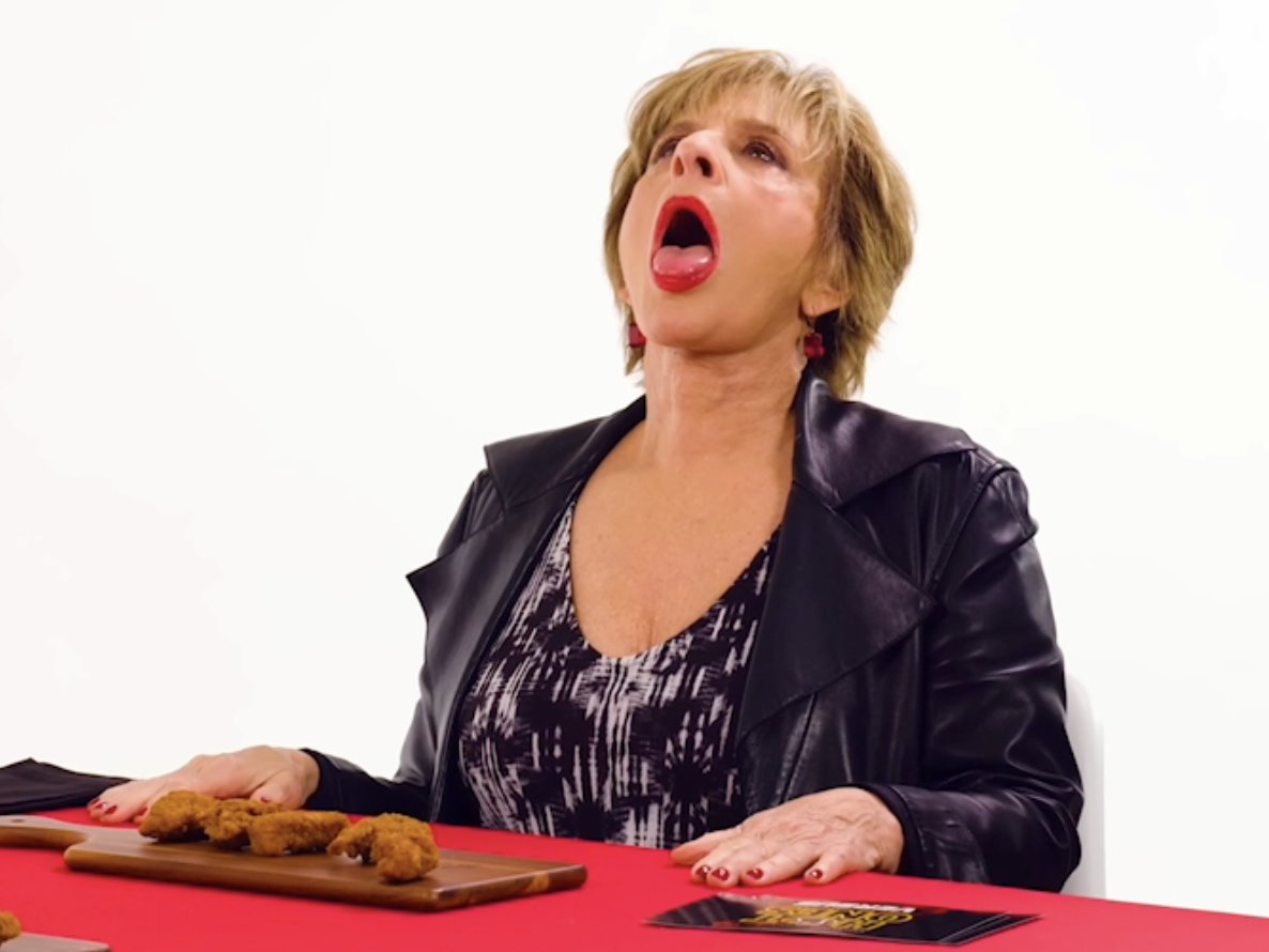 Patti LuPone's reaction to eating her first Hot Ones wing must be experienced
