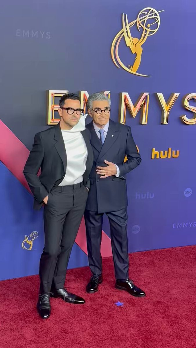 #Emmys hosts Dan and Eugene Levy walk the red carpet