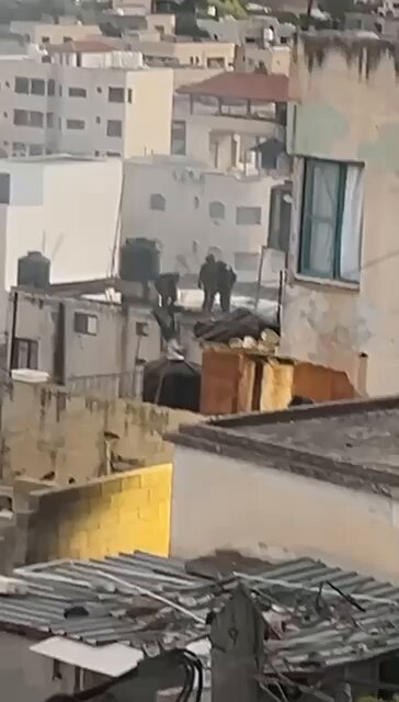 WEST BANK: Incredibly disturbing video shows Israeli soldiers throwing bodies of Palestinians off a roof in Qabatiya near Jenin. At least 5 Palestinians were killed by Israeli forces during a military raid.