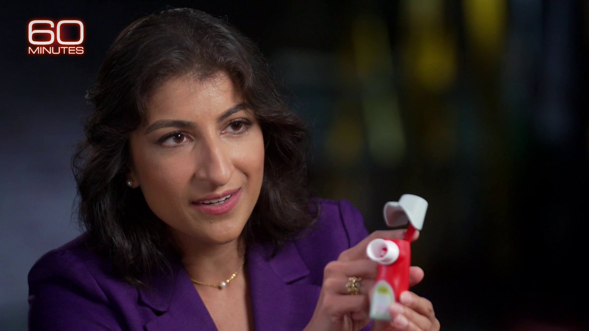 FTC Chair Lina Khan shows Lesley Stahl an asthma inhaler that costs dollars in Europe but hundreds in the U.S. She says drugmakers register patents on inhaler parts like the cap-strap to keep low-cost generics off the market.