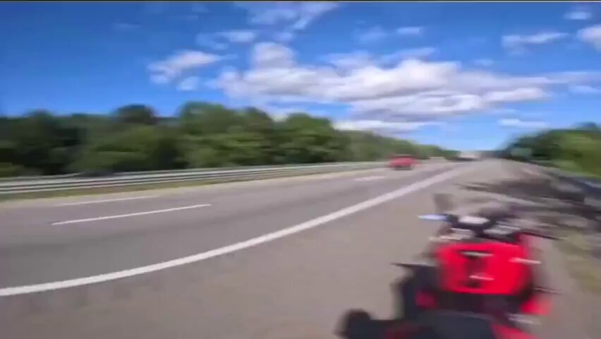 Guy sees speeding motorcyclists and overtakes them in seconds. This is wild