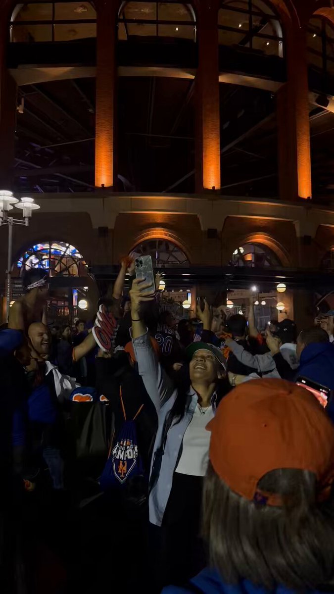 the hottest club in New York is this group outside of Citi Field jumping to Don’t Stop Believin’