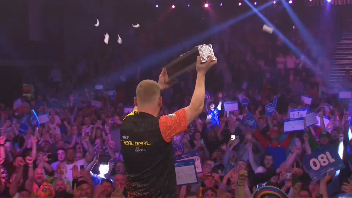 YOUR CHAMPION! 🏆 What a moment for Mike De Decker! He almost forgets to collect the trophy, but who can blame him? 😂 #WGPDarts | Final