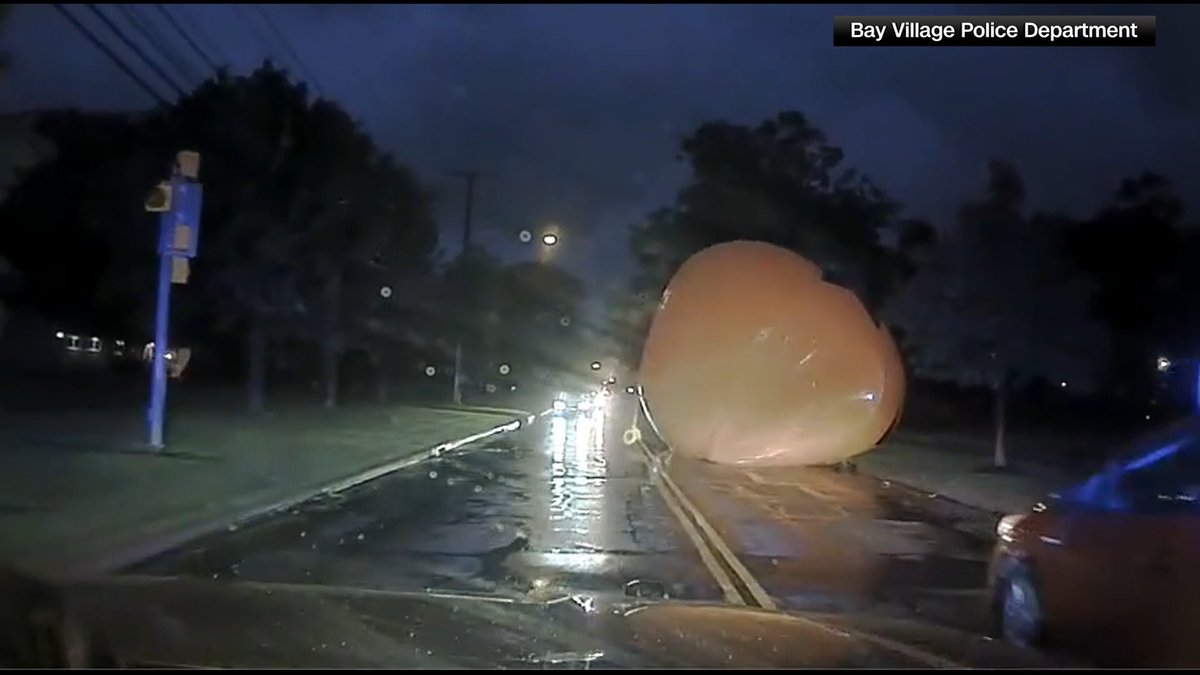 Video shows Ohio officers battling a large inflatable jack-o'-lantern.