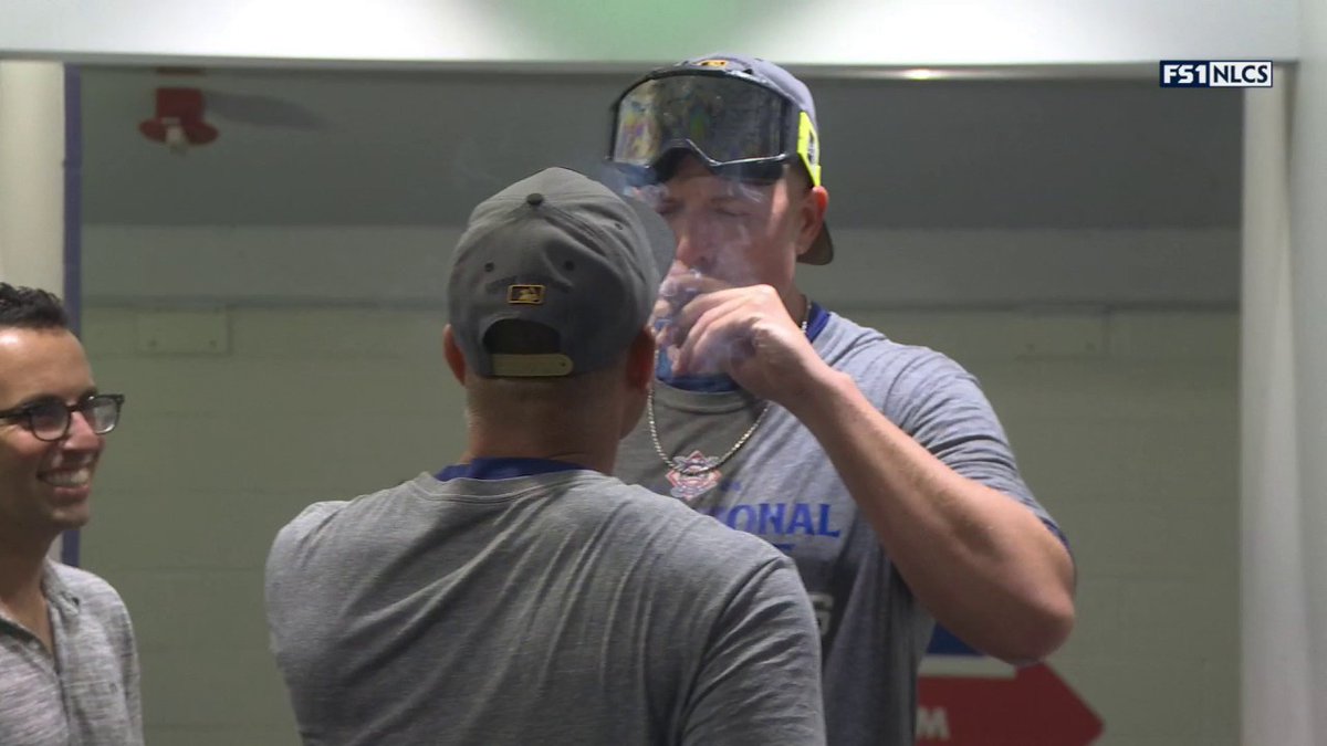 Blake Treinen and Dave Roberts celebrating with victory cigars 🔥
