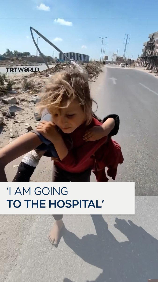 “I'm tired, I have been carrying her for an hour and I can’t now” A Palestinian child struggles to carry her younger sister barefoot to a hospital, after she was injured in a car accident in Gaza