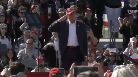 Trump salutes while playing an alternative national anthem at his rally, featuring violent January 6 insurrectionists: Please rise for the unfairly treated January 6 hostages