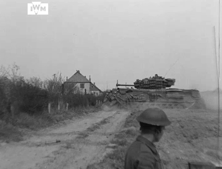 Churchill tanks advance during the Allied assault on Uelzen, Germany, April 1945. Film: IWM A70 302-3
