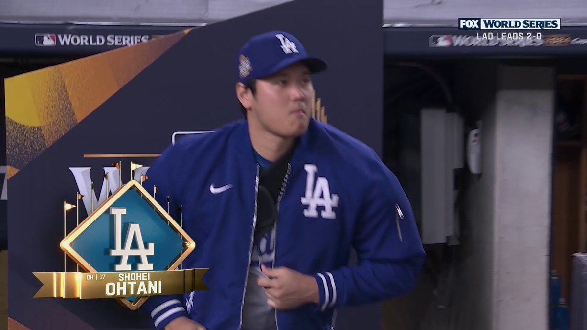 Ohtani appears to be wearing a sling as he is introduced at Yankee Stadium before Game 3.