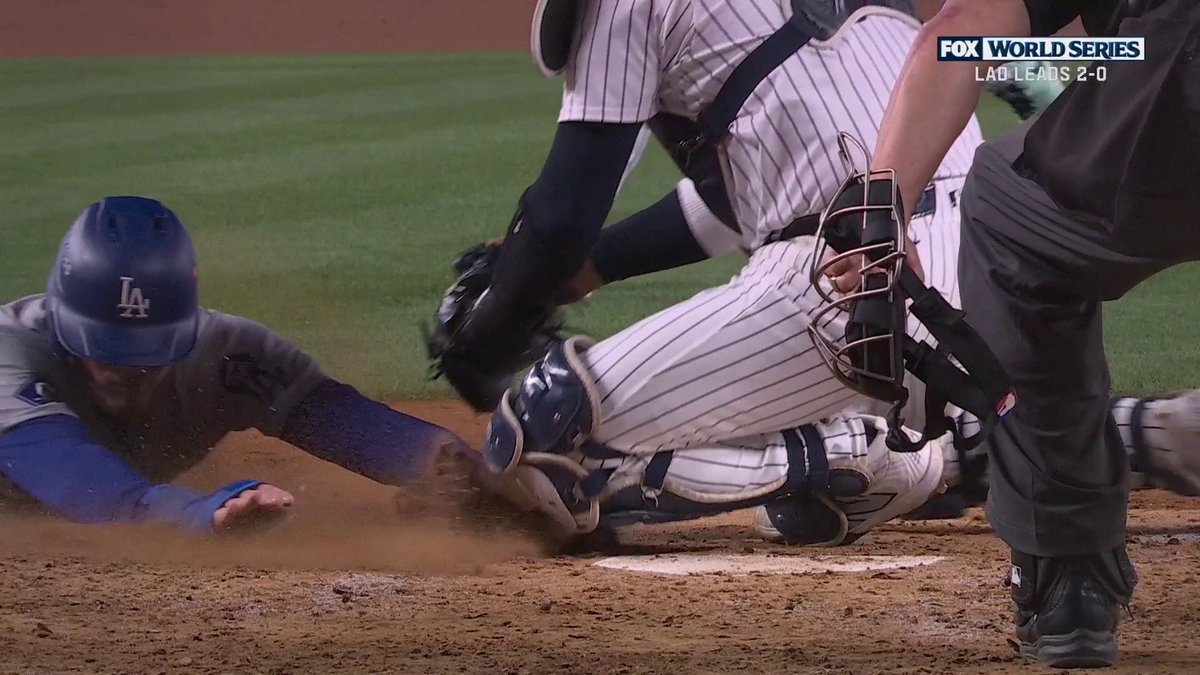 Runner remains out after review, despite John Smoltz repeatedly saying he could see his hand touch home before the tag