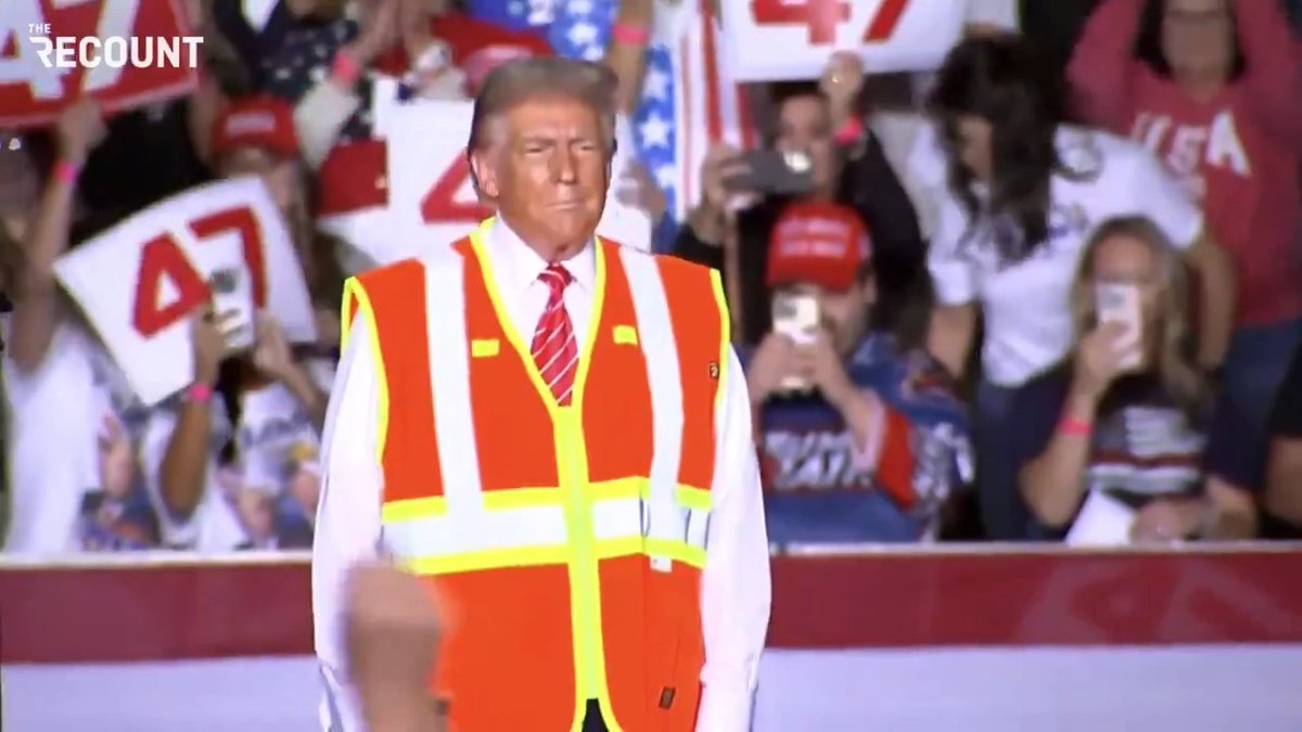 Donald Trump comes out for his Green Bay campaign rally dressed as a sanitation worker after President Biden's "garbage" gaffe.
