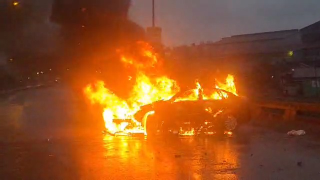 BREAKING: An accident has occurred at the Namboole flyover involving a taxi number UAX 036F and a black saloon car, which caught fire as a result of the collision. #VisionUpdates 🎥: Mpalanyi Ssentongo