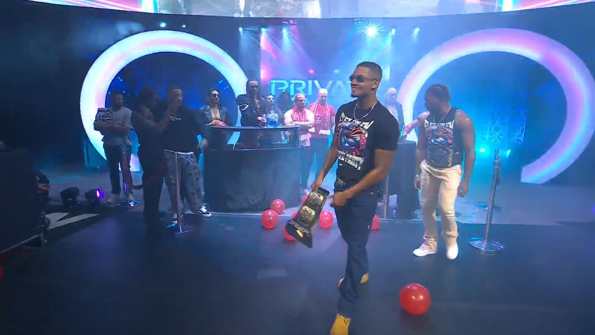 Collision kicks off with the AEW babyface roster in the ring with Tony Schiavone... welcoming new tag champs, PRIVATE PARTY! Zay and Quen flexing on all the tag teams standing on the stage. LFG. 💪