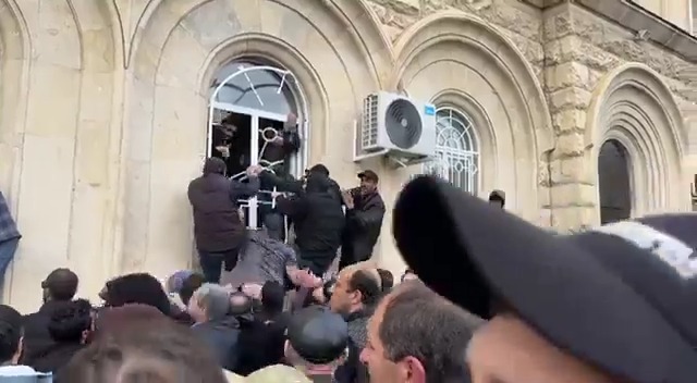 protesters storm the parliament of russian backed georgia separatist region abkhazia + demand resignation of president bzhania