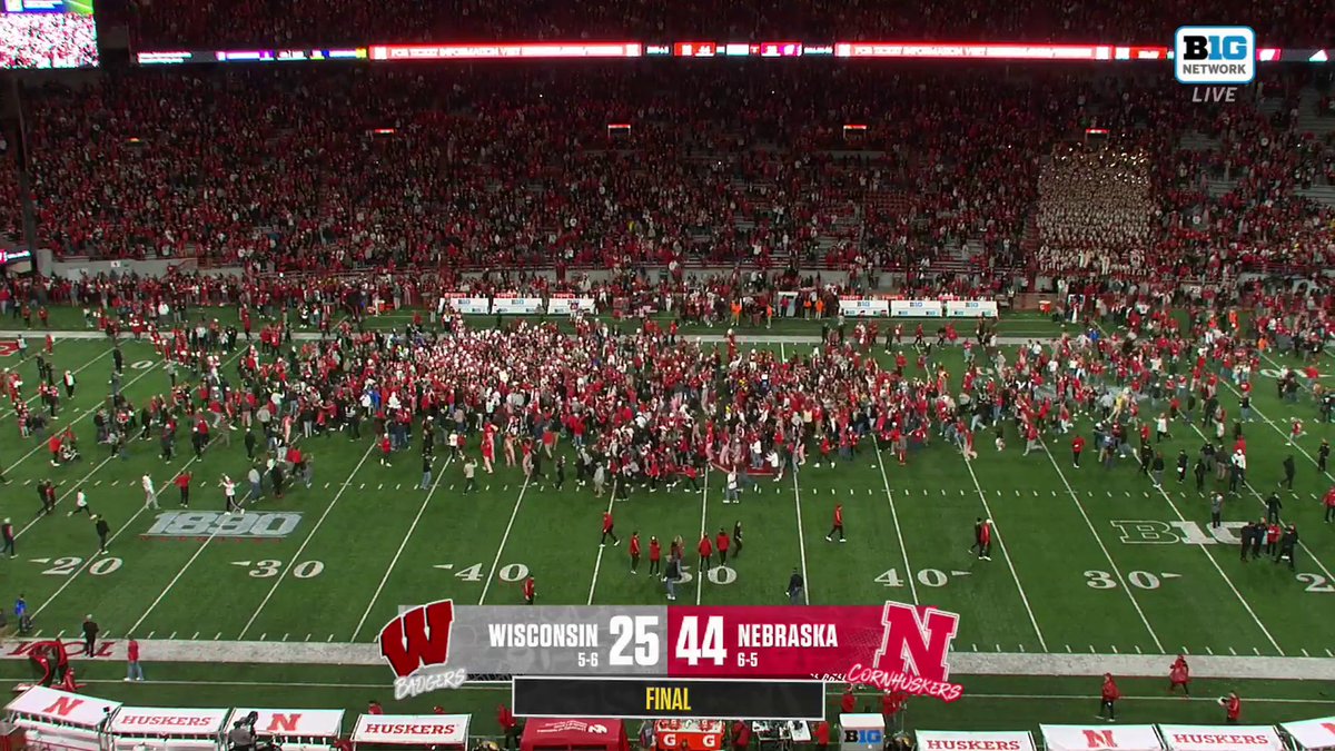 NEBRASKA FANS STORMING THE FIELD!!! 🌽