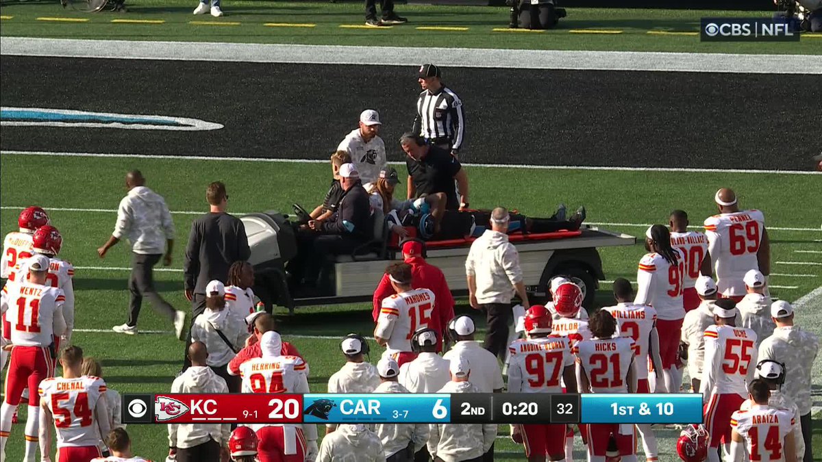 Panthers tight end Ja'Tavion Sanders raises his arms to the crowd while being carted off after a scary injury.