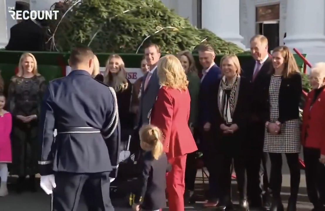 First Lady Jill Biden and her grandson Beau retrieve the White House Christmas tree.