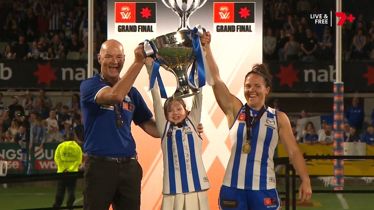 Little Imogen Mulgrew presents, and lifts, the premiership cup! A gorgeous moment ❤️️ #AFLWGF
