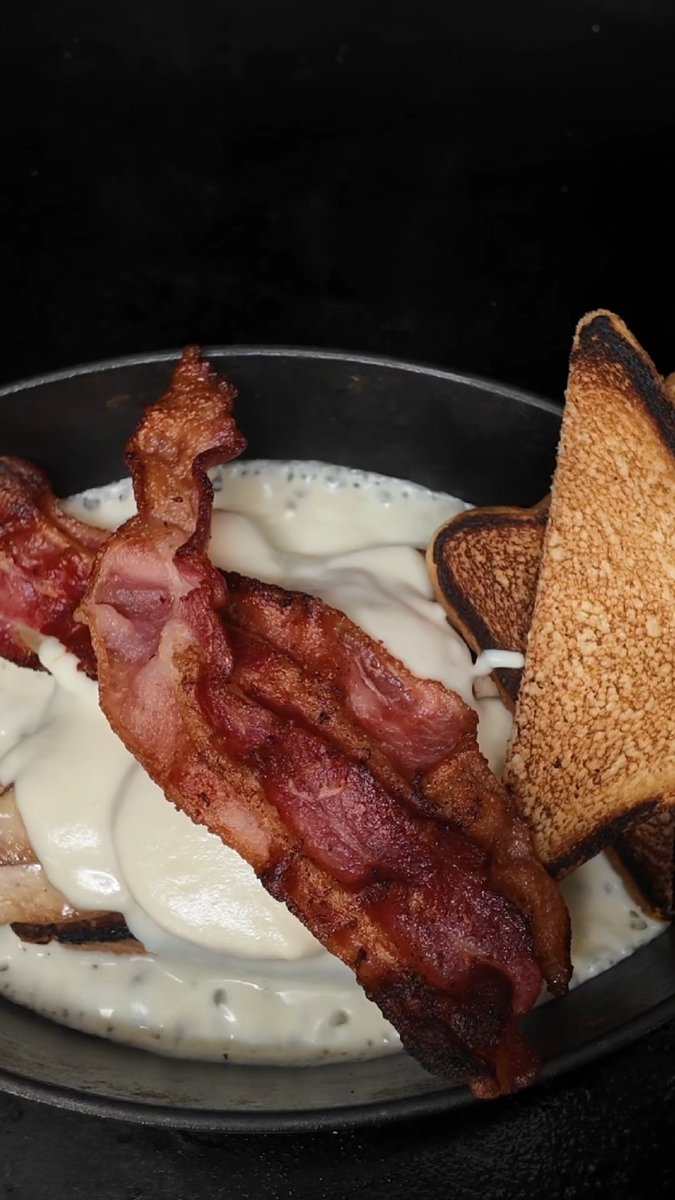 The Kentucky hot brown has been a tradition since its creation at Louisville's Brown Hotel in 1926. The open-face sandwich, made on the Flatrock griddle, is a great way to use leftover Thanksgiving turkey 🔥 Tap the link below for the full recipe: #TraegerGrills #TraegerRecipes #TraegerThanksgiving #Traeger #Traegerhood