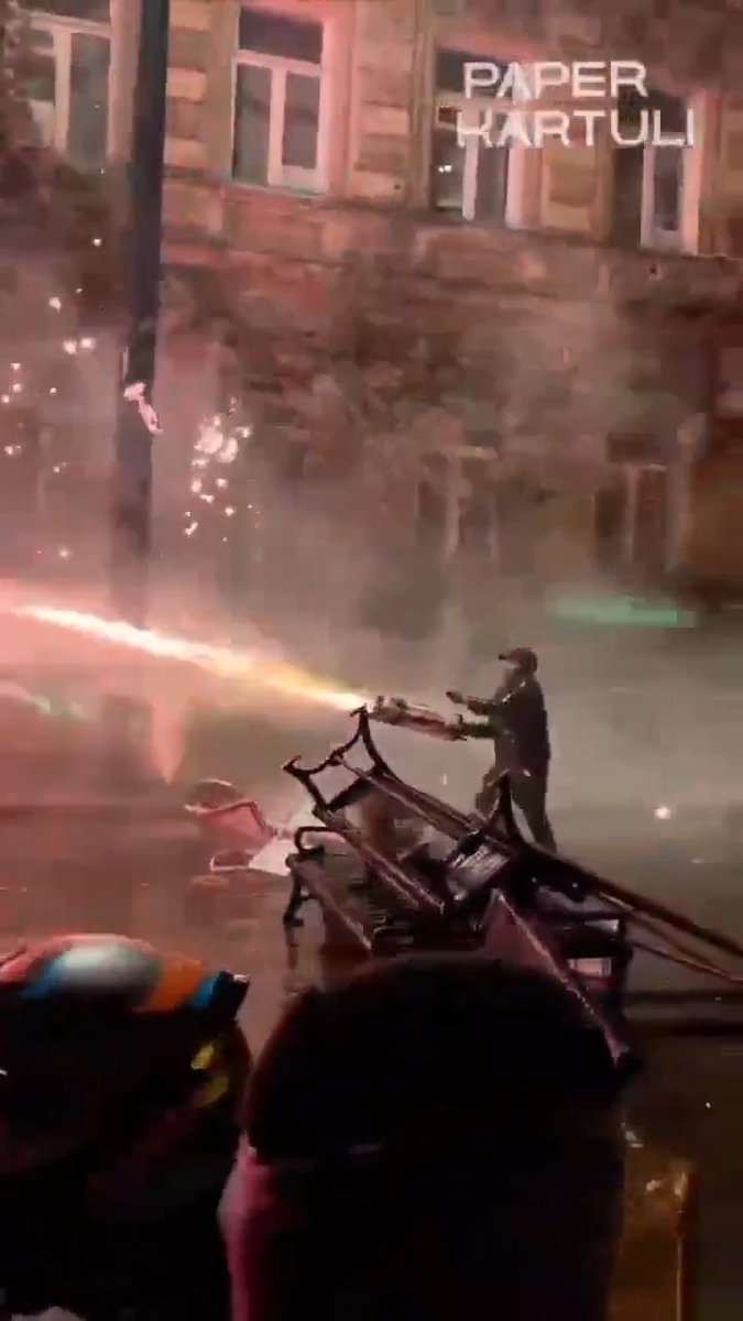 Whatever this "fireworks mini gun" is - I need it in my life 🔥 "TBILISI, Nov 30 (Reuters) - Many thousands of demonstrators gathered late on Saturday in Georgia's capital Tbilisi, building barricades, breaking windows and setting off fireworks outside parliament, in protest against the government which called off talks to join the EU. Riot police responded by firing water cannon and tear gas into the crowds." #georgia #tblisi #russia #fireworks #protest